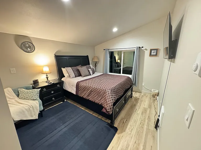 Primary Room with Smart TV and fully adjustable Queen-sized bed