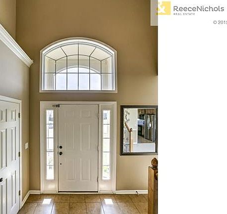 Open Grand Entry with Stunning Iron Spindles on staircase