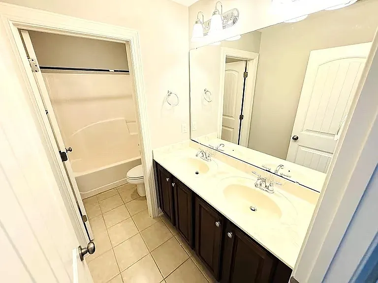 Bathroom 3, with two sinks and separate bathtub space