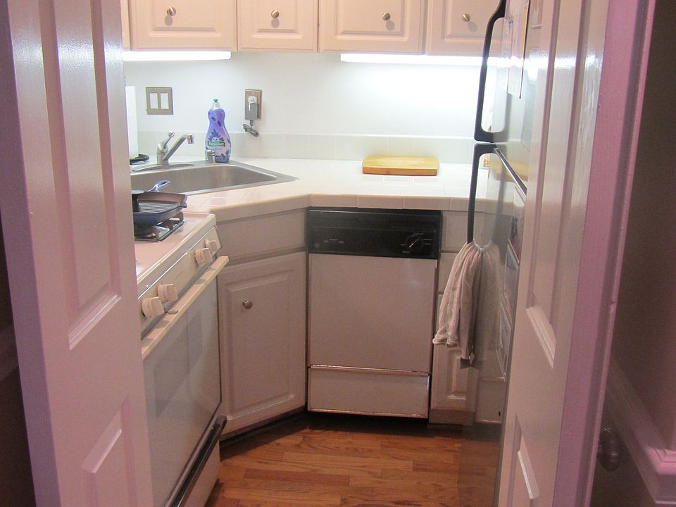 Kitchen with gas stove, microwave, refrigerator, and dishwasher