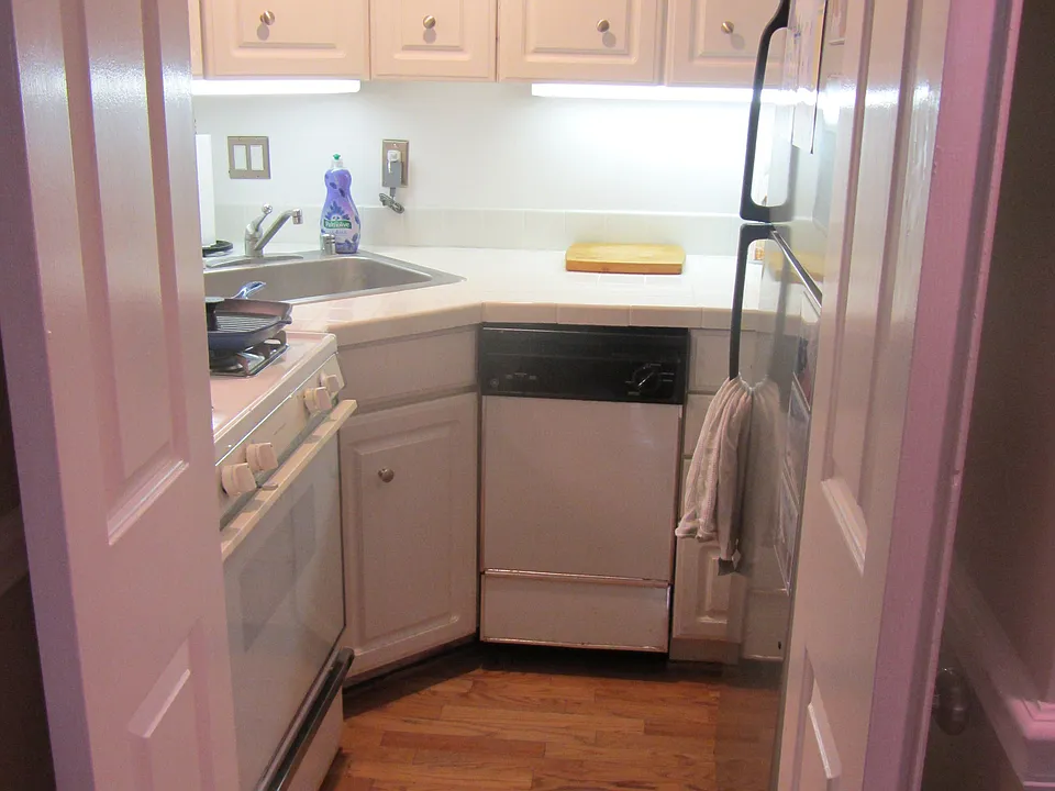 Kitchen with gas stove, microwave, refrigerator, and dishwasher