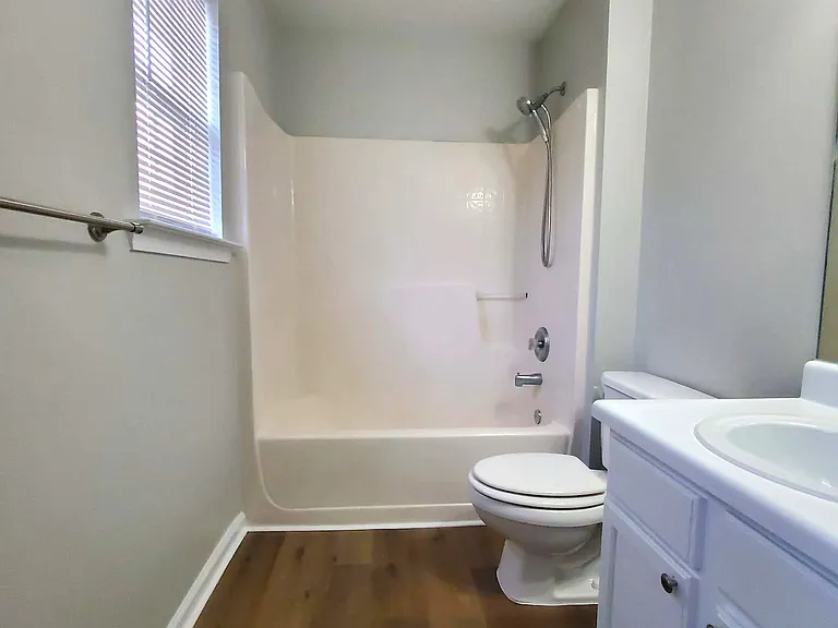 Ensuite bath in secondary bedroom also has hallway access.