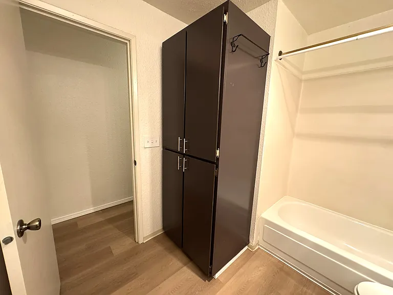 Large linen cabinet in bathroom