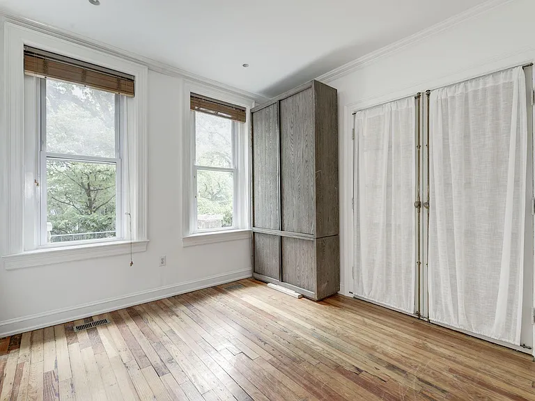 Main level 4th bedroom/family room with Restoration Hardware armoire