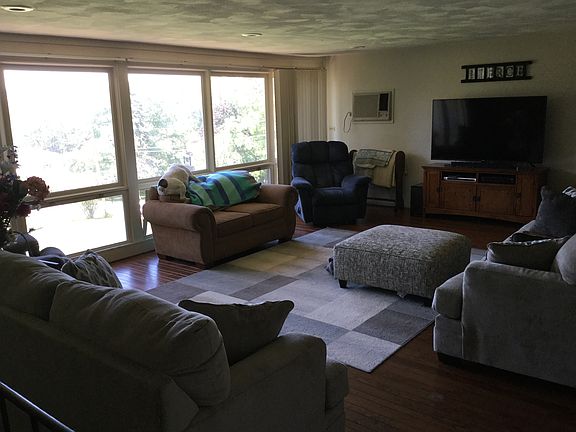 Living room with 26’ wall of