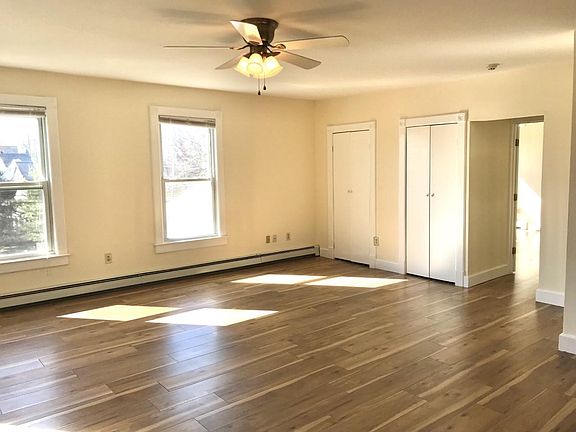 Living room with 4 large windows, 2 full size closets.
