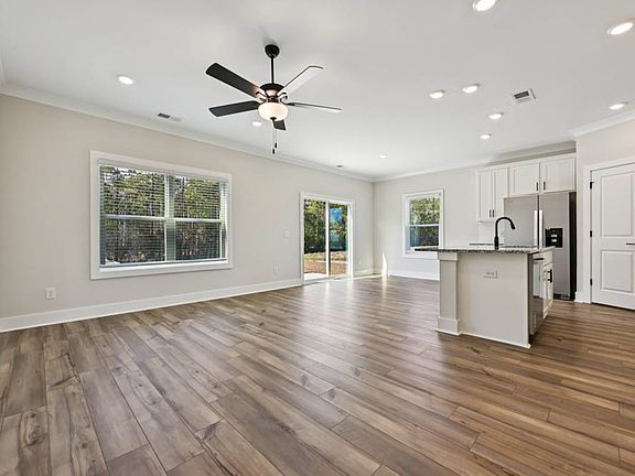 The living room, kitchen and dining room create the perfect space to host friends and family