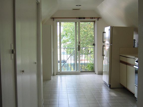 another view of kitchen with storage/pantry door on left