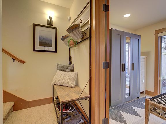 Front entry and view of main floor bedroom, w/3/4 bath, tile flooring and direct access to backyard