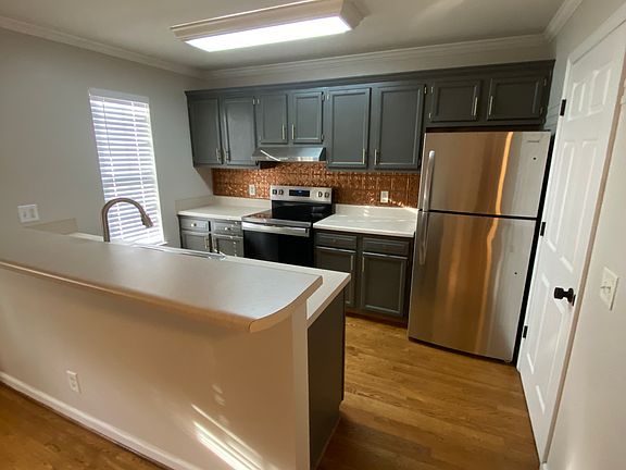 Kitchen includes breakfast bar.