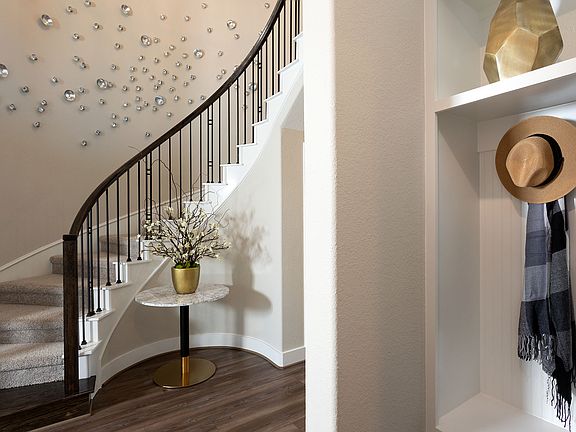 Hang your hat and stay awhile with a built in hall tree and open foyer.