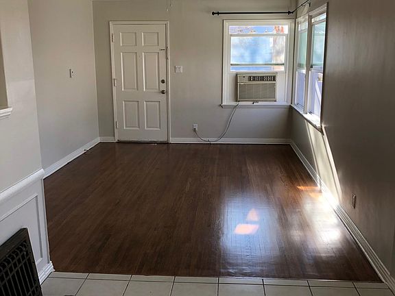 Refinished classic hardwood floors in living room, hallway and bedrooms, AC in living room with new ceiling light fan.