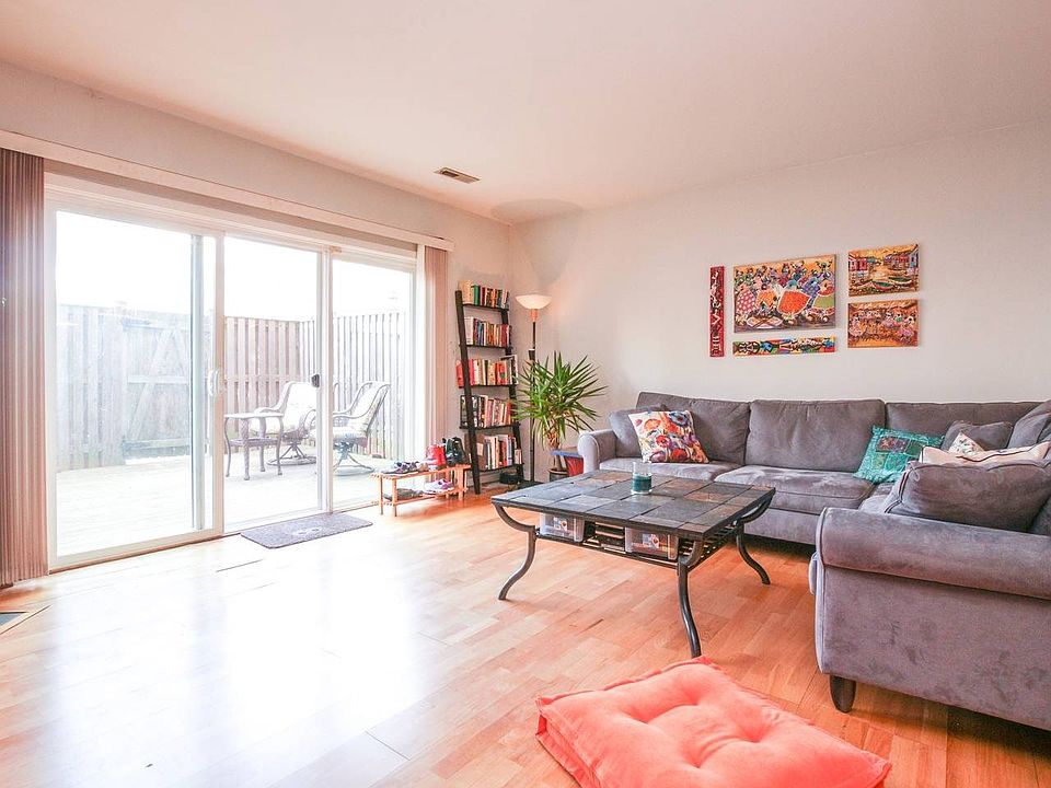 living room opens up to fenced deck