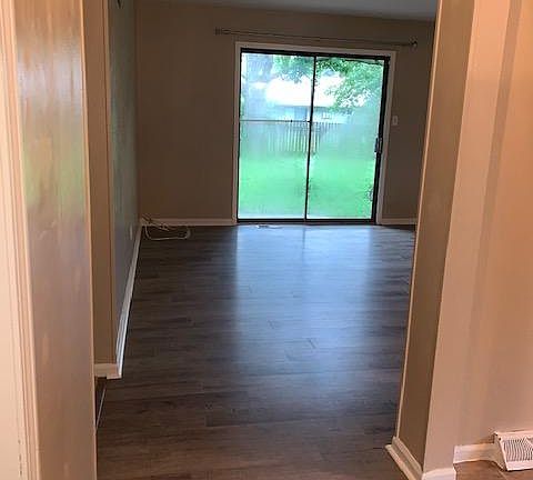 New plank flooring through entry & into large living space