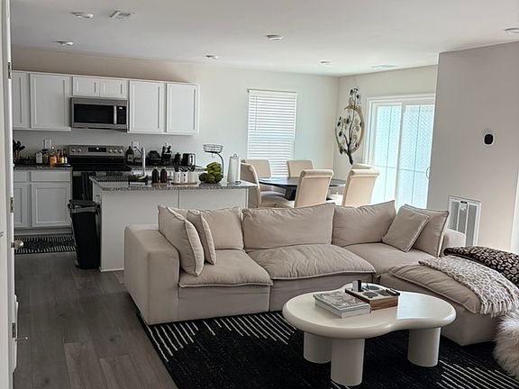 Open living room concept with kitchen (Appliance available - dishwasher, microwave, refregirator, oven)
