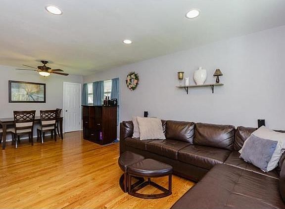 Dining Area - hardwood floors, storage closet, ceiling fan with light.