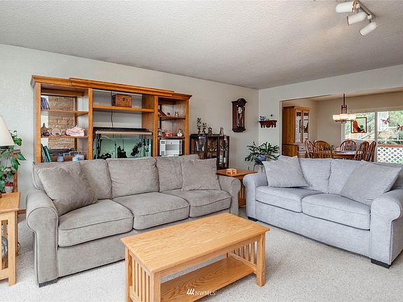 Living room connects to hall and dining room