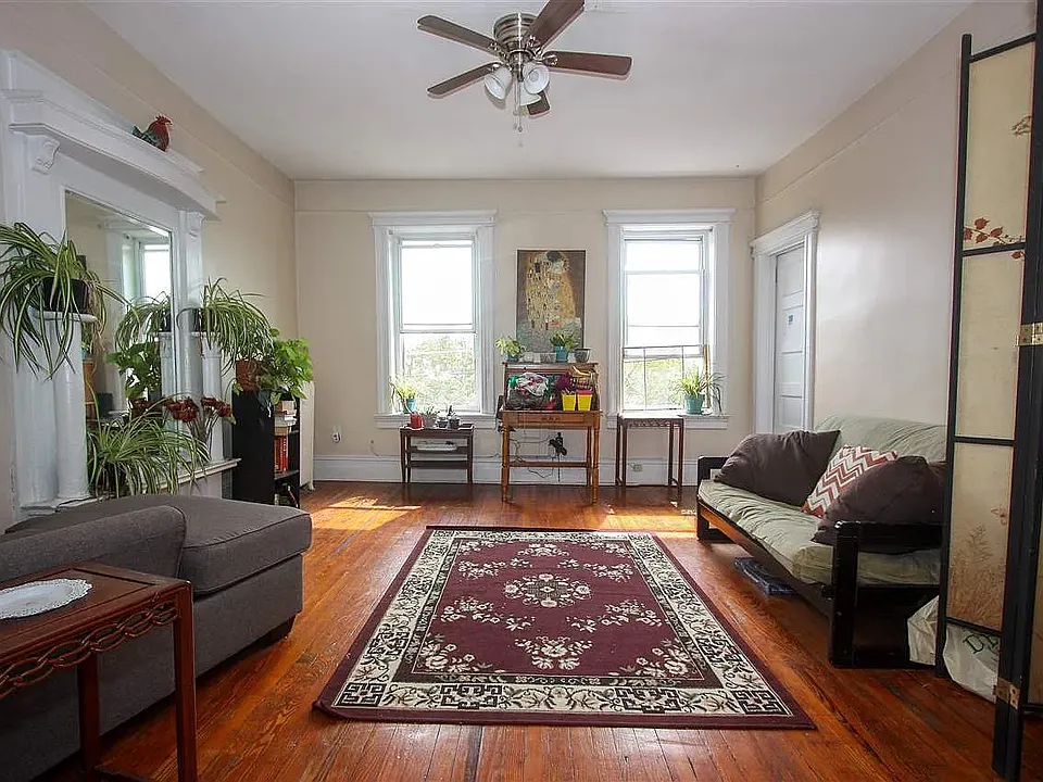 This is the living room overlooking the park with partial views of the Manhattan skyline