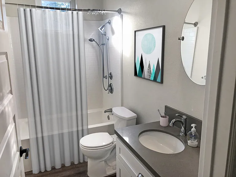 Bathroom with high pressure double head shower. Window or fan for ventilation.