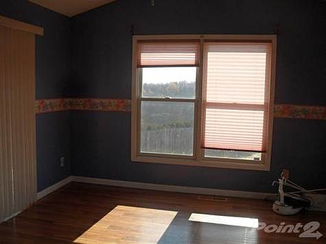 Sunroom leads to large deck for entertaining ad overlook inground pool!