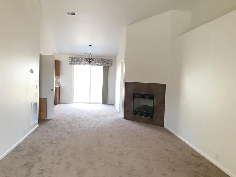 Large family room with gas fireplace. Dining room