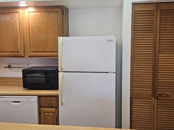 view of kitchen from living room through "island."
