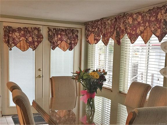 Expanded dining, doors exiting to deck.
