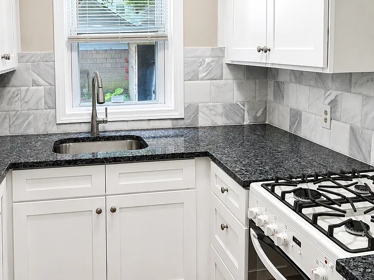 Fully renovated kitchen with granite countertop and brand new oven/stove.
