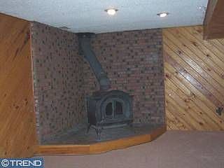 Family Room w/Corner Woodburning Stove