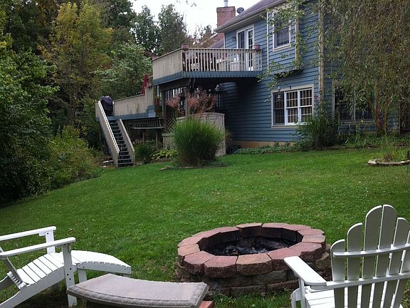 A view from the backyard looking at teh decks nad patio