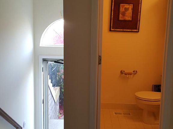 Powder room and view of front door