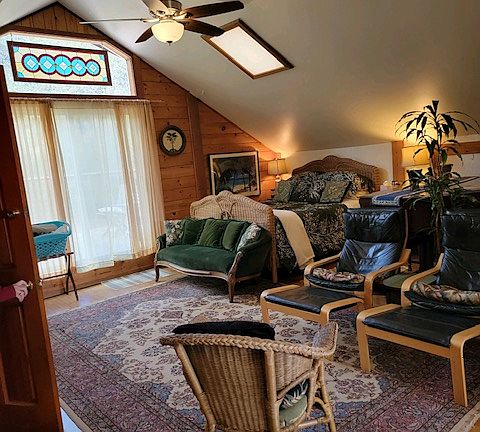 Sliding glass door out to large deck. Outdoor dining and vast views.