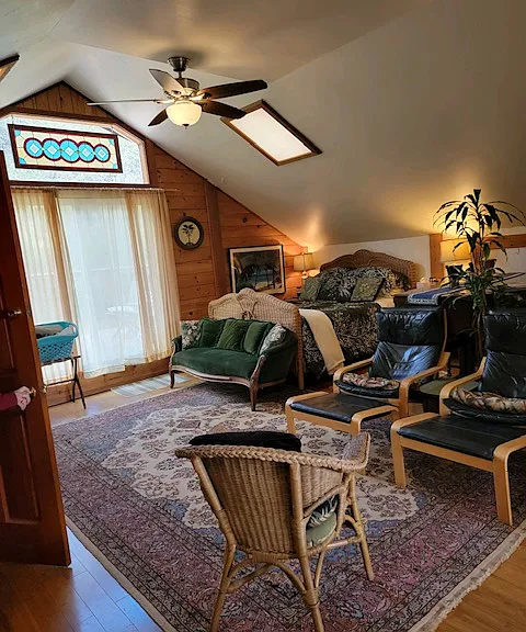 Sliding glass door out to large deck. Outdoor dining and vast views.
