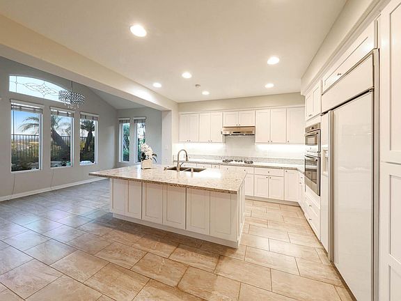 Expansive gourmet kitchen and nook with a large island.
