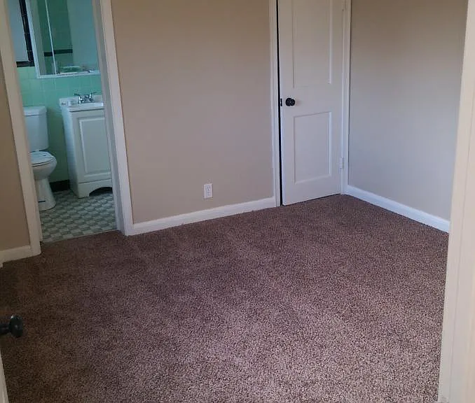 bedroom with new carpet and paint