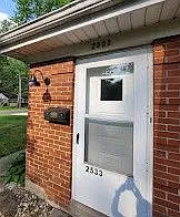 Front door with storm door and new lighting
