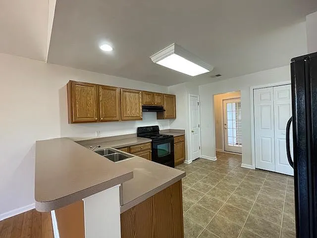 Kitchen with breakfast bar.