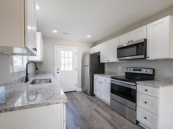 Stainless steel appliances and all hard surface counter tops in the kitchen! Plenty of storage too!