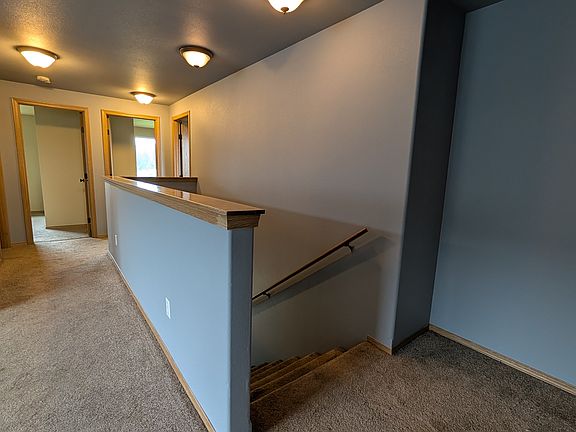 view from stair llanding to bedrooms 2, 3, 4 and bath