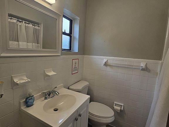 Bathroom in back hallway near room 5 &6