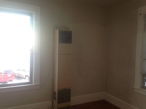 east bedroom w/wall gas furnace