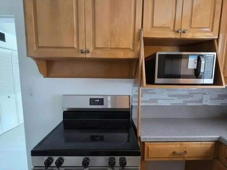 new electric Frigidaire stove, provided free of charge