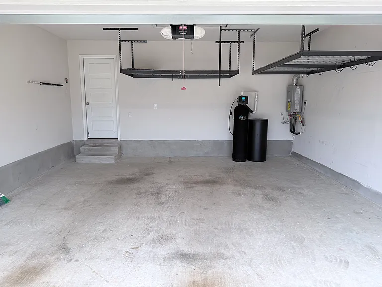 Two car garage with overhead storage racks