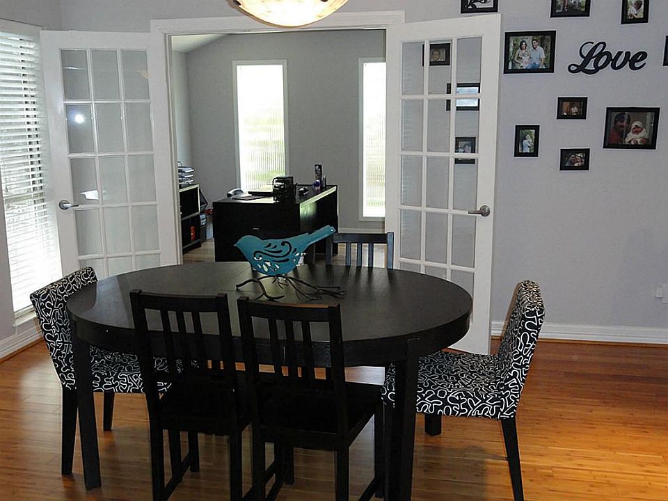 Light/Bright formal Dining offers bamboo floors and custom builtins