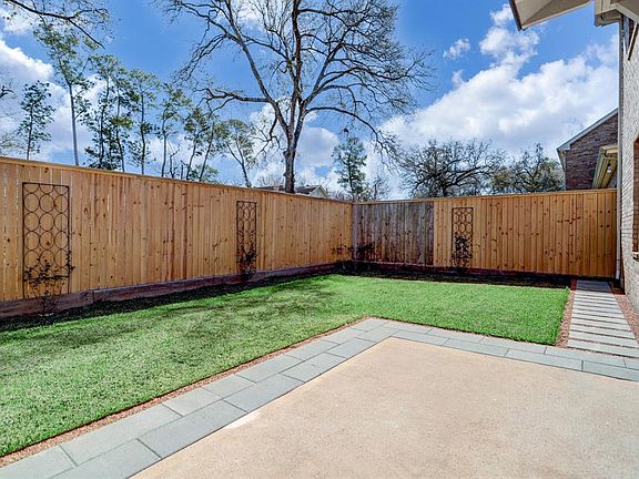 Relax in your private backyard with extended patio, recent fencing and trellis details