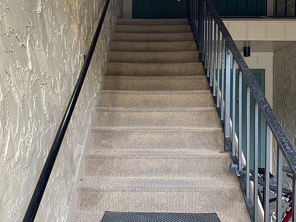 Easy access by wide stairs to second floor unit.