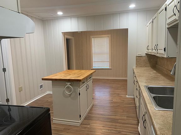 Large Kitchen with Updated Storage Options and Cutting Board Island