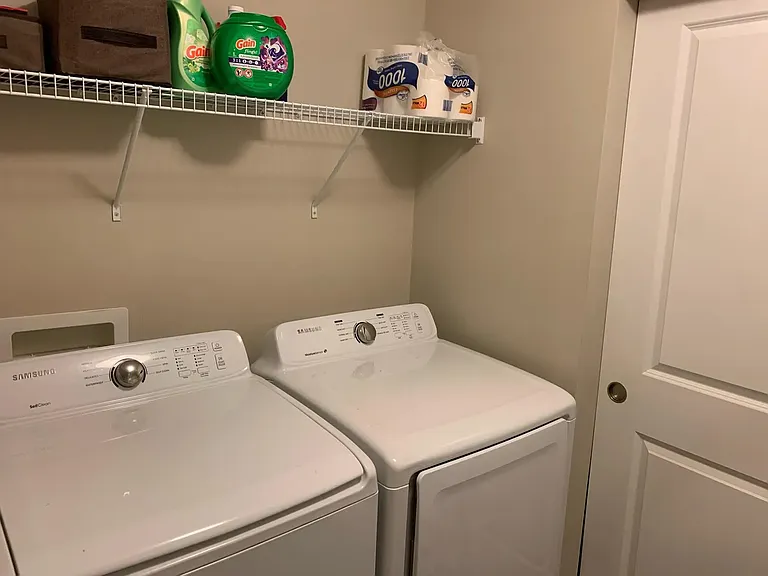 Laundry room next to kitchen