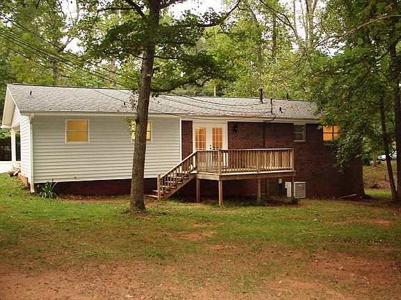 Back view of deck overlooking nice tree shaded yard
