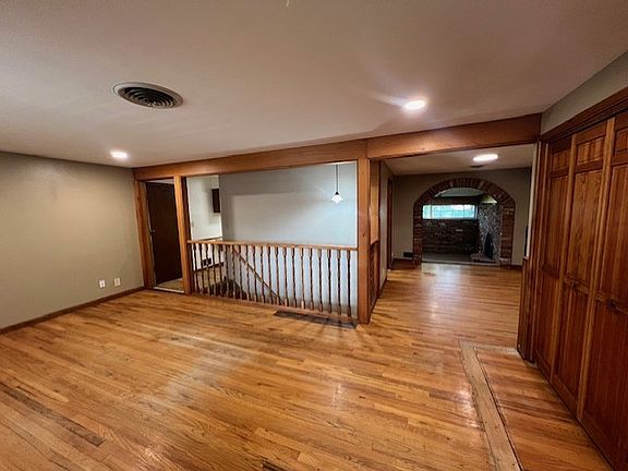 large living room with hardwood floors